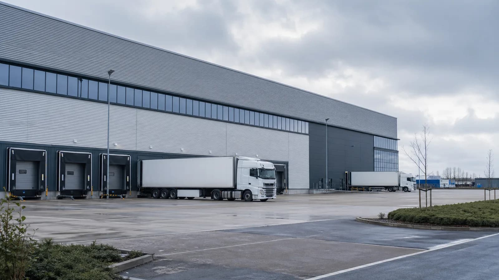 Modern industrial and logistics units in a Trafford Park-style UK business estate.